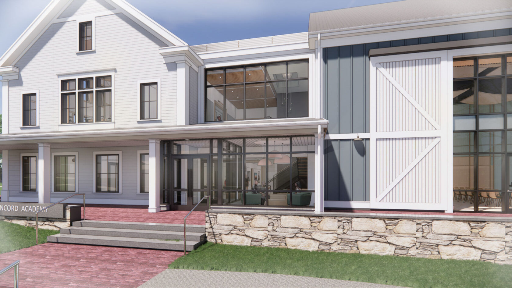 Modern building with large windows, a white and gray exterior, a covered entrance with glass doors, and a small lawn. Steps with railings lead up to the entrance. "CONCORD ACADEMY" sign visible.